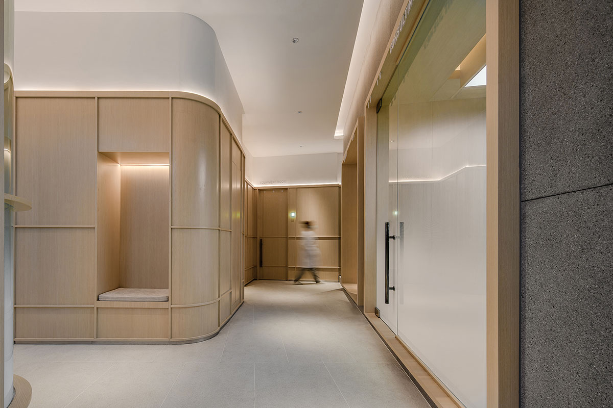 JACKY.W DESIGN completes dental clinic with rounded wooden walls and natural tones in China 