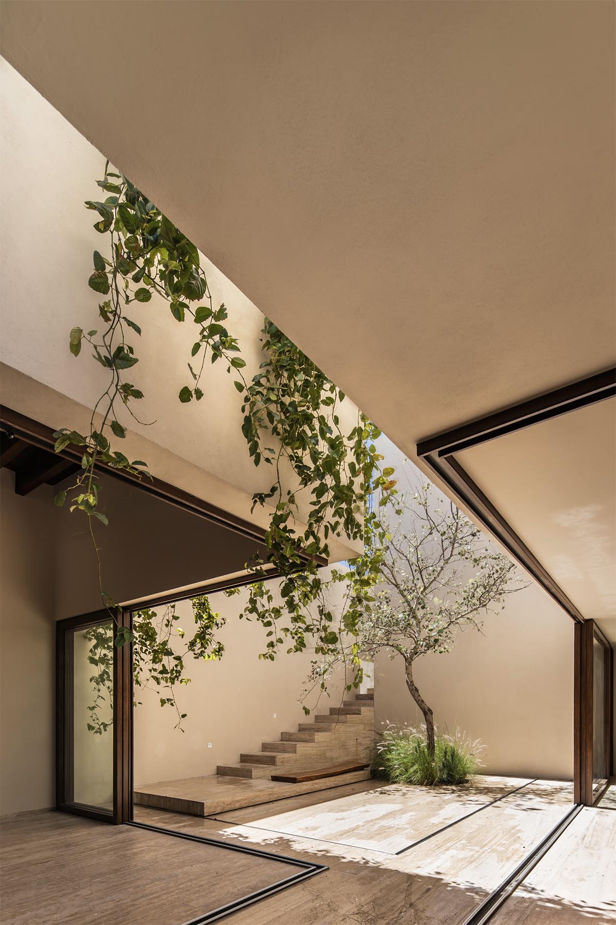 Sabino 10 residence by Editorial features a solid façade with hermetic volumes in Mexico