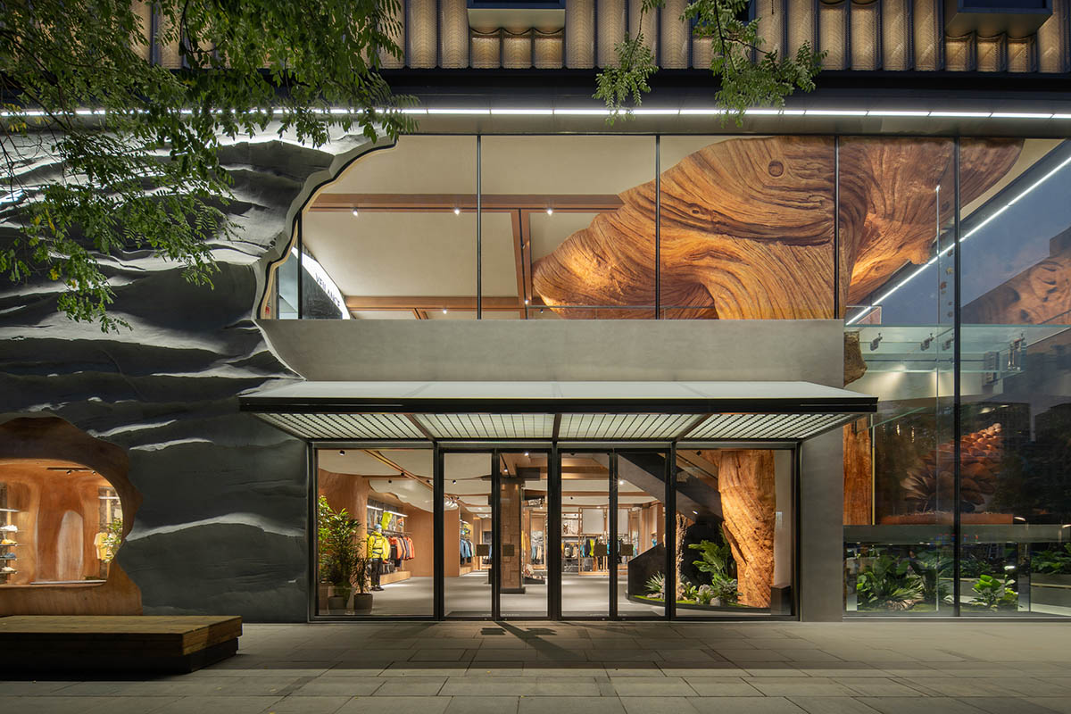 STILL YOUNG creates cave-like interiors for a store with wood and rock elements in Beijing 