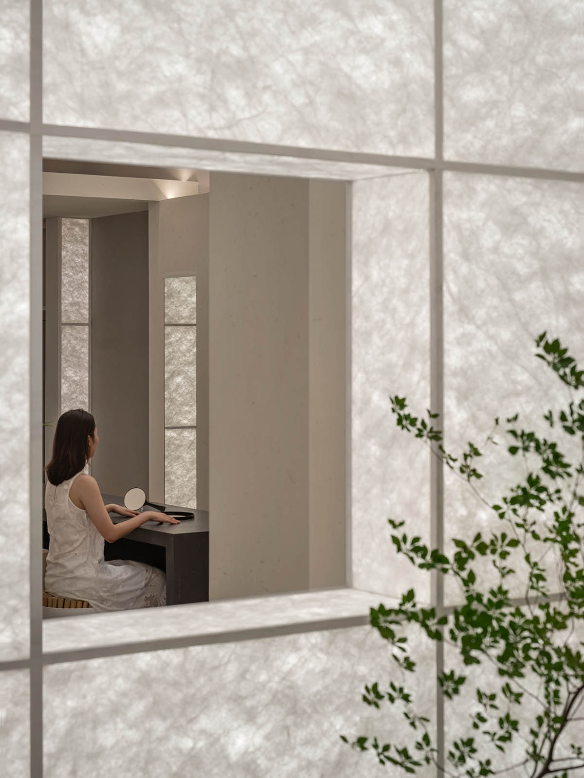 Luminous screen walls create fluid interiors for an optic store designed by Onexn Architects 