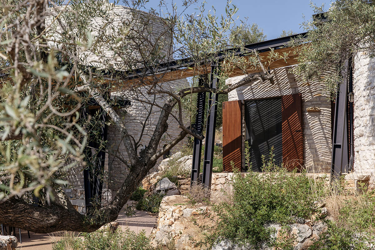 Pastoral round stone dwellings inform Meganisi House by Hiboux Architecture on Meganisi island
