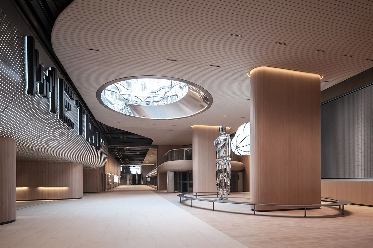 TOMO Design creates interiors for metro station with soft wood hues and circular light strip