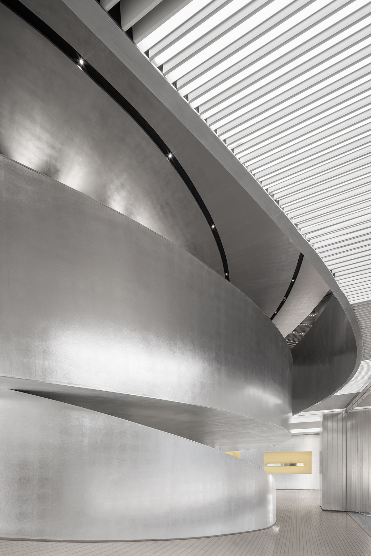 Various Associates designs beauty store with winding staircase and silver-toned interiors in Hangzhou