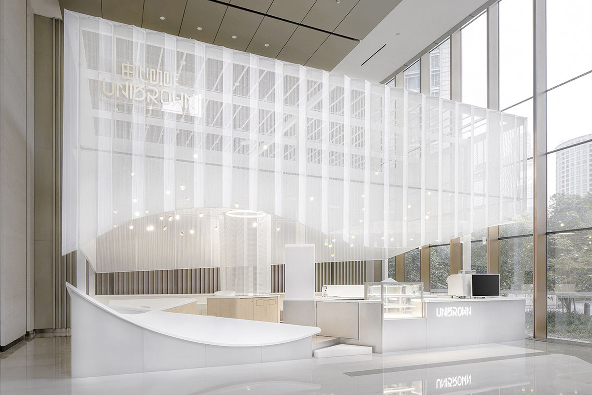 Mur Mur Lab uses all-white folded panels to create nature terrain for a coffee store in Shanghai