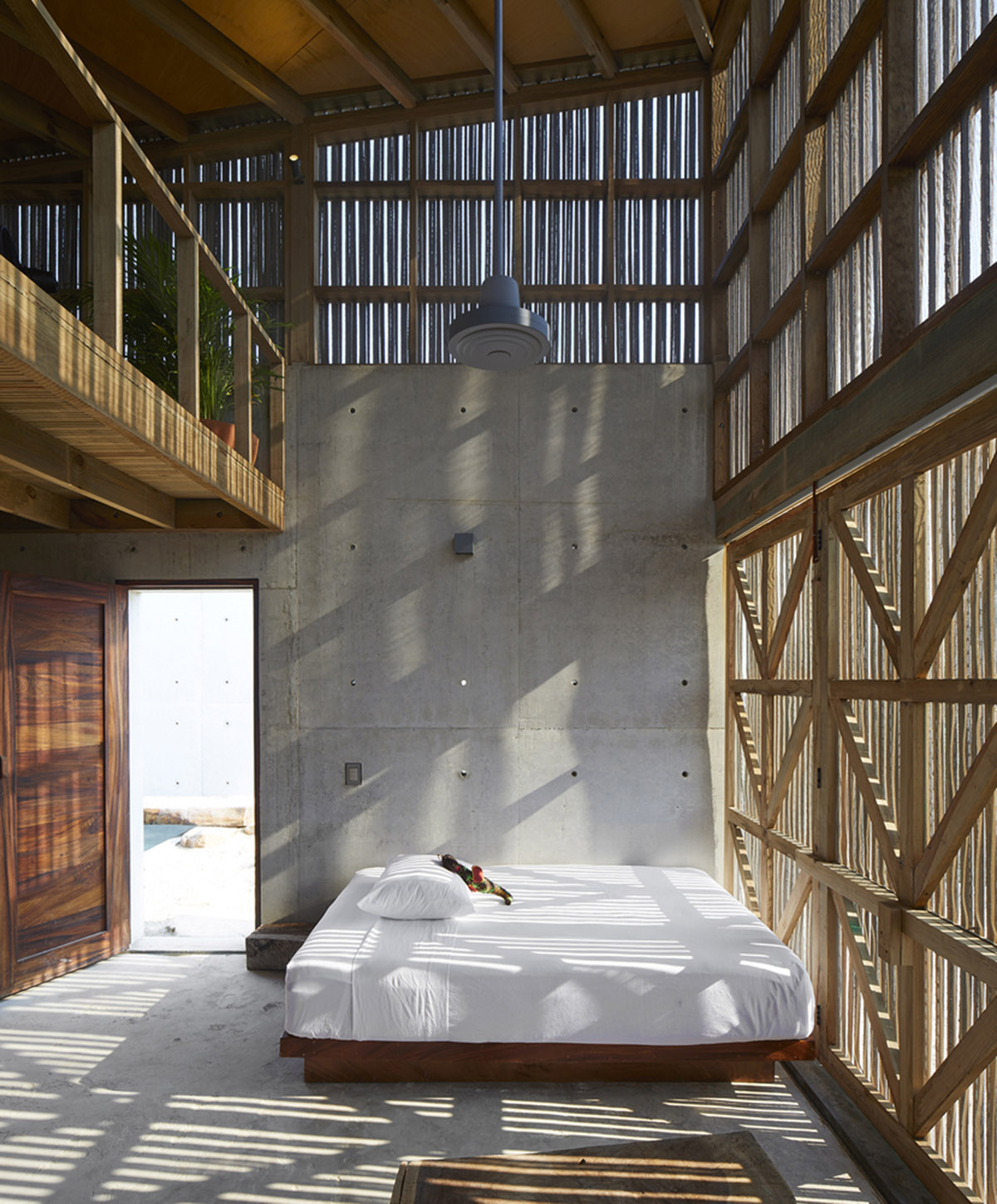 Four concrete and wooden volumes form Casa Naila paying tribute to Oaxaca’s rural architecture