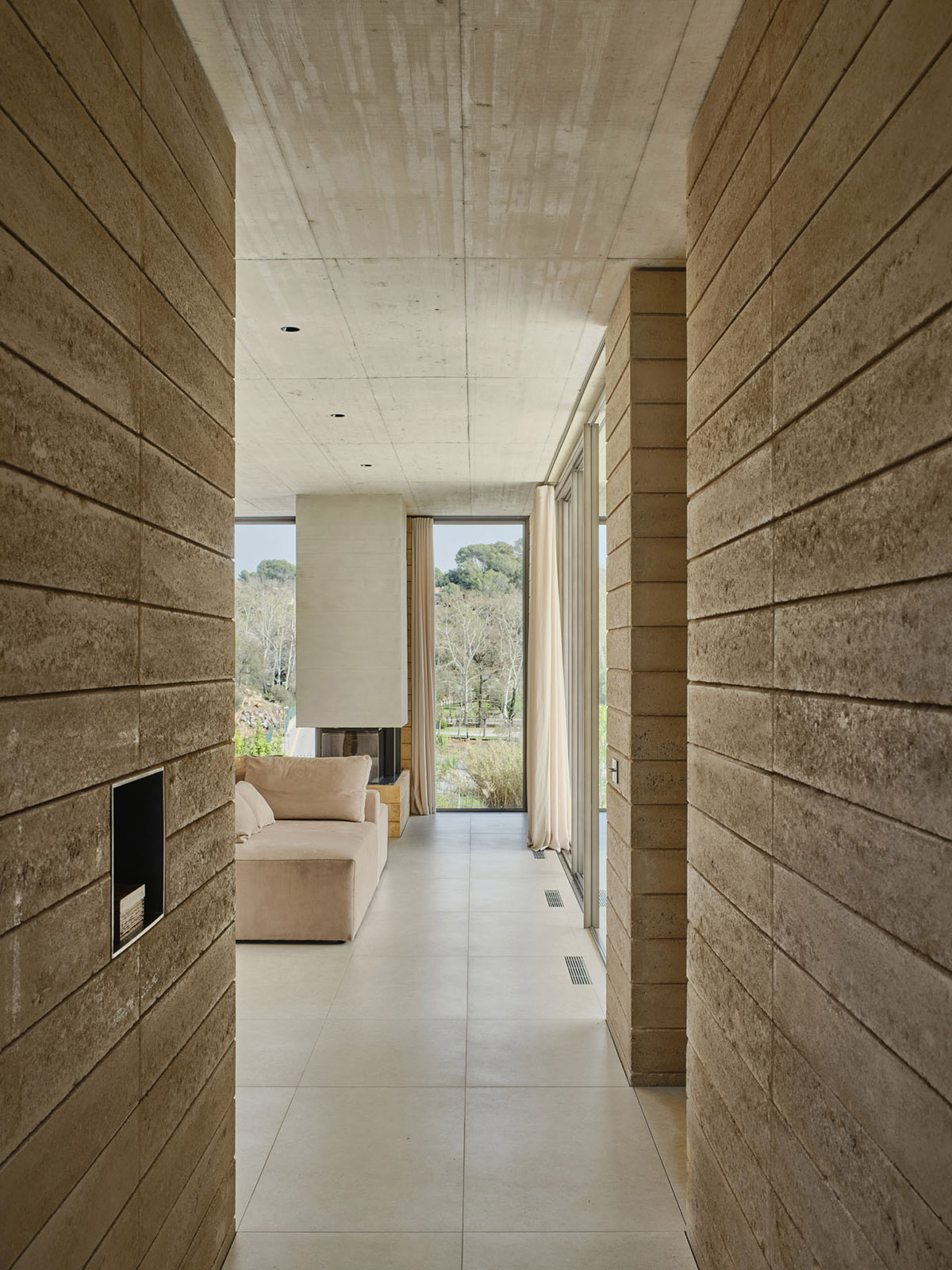Atheleia Arquitectura completes Casa Artiga with rammed earth walls in Barcelona 