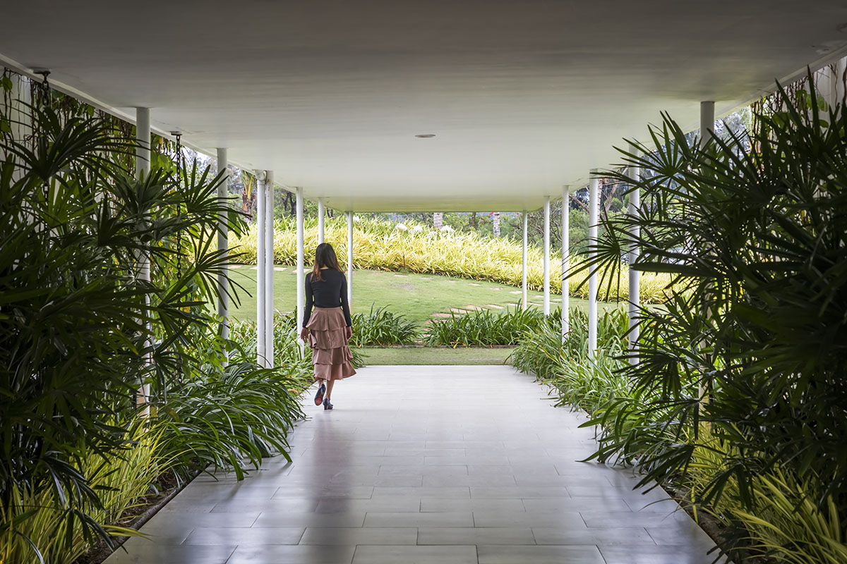 Six landscape boxes form this gallery and showroom by MIA Design Studio in Vietnam