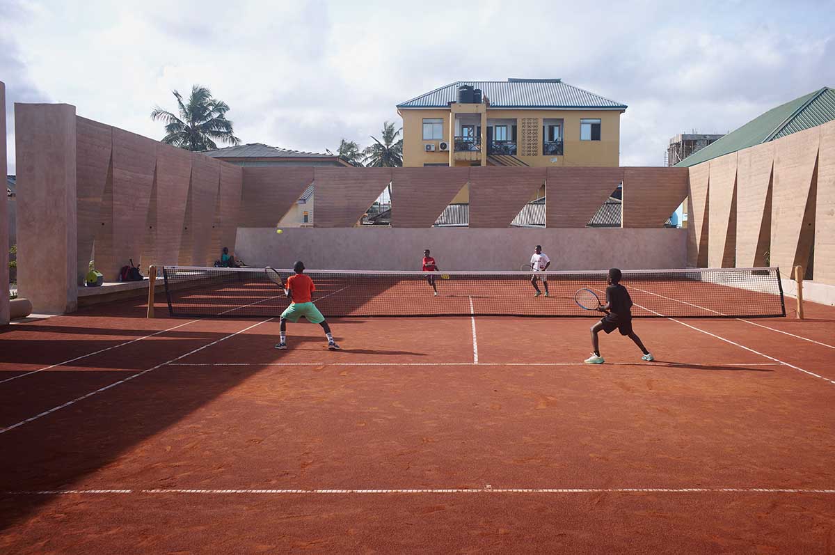 Backyard Community Club features triangular rammed earth system as a replicable prototype in Accra 