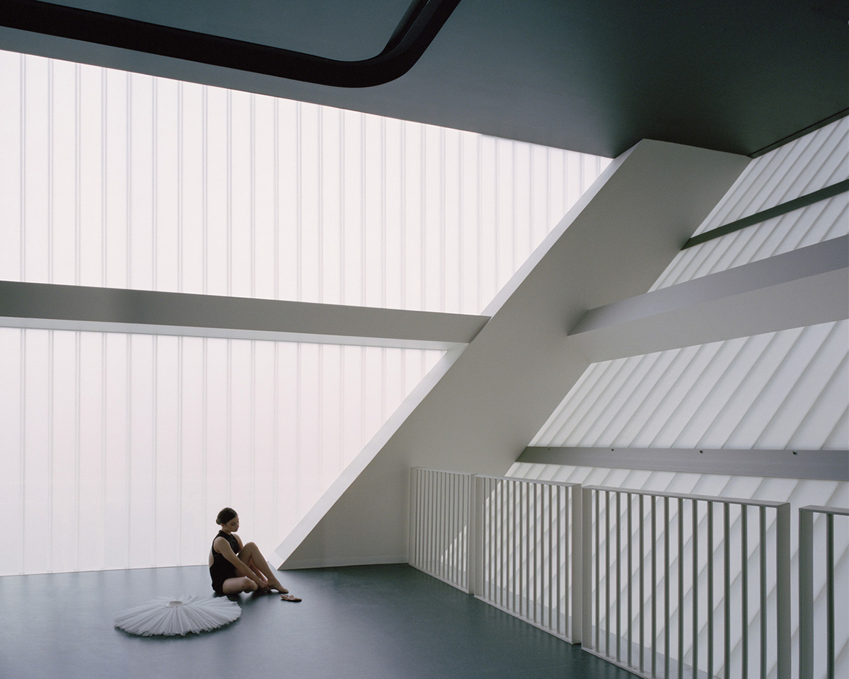 Hassell reveals Arts Centre with sliced translucent volume which is in dialogue with historic church