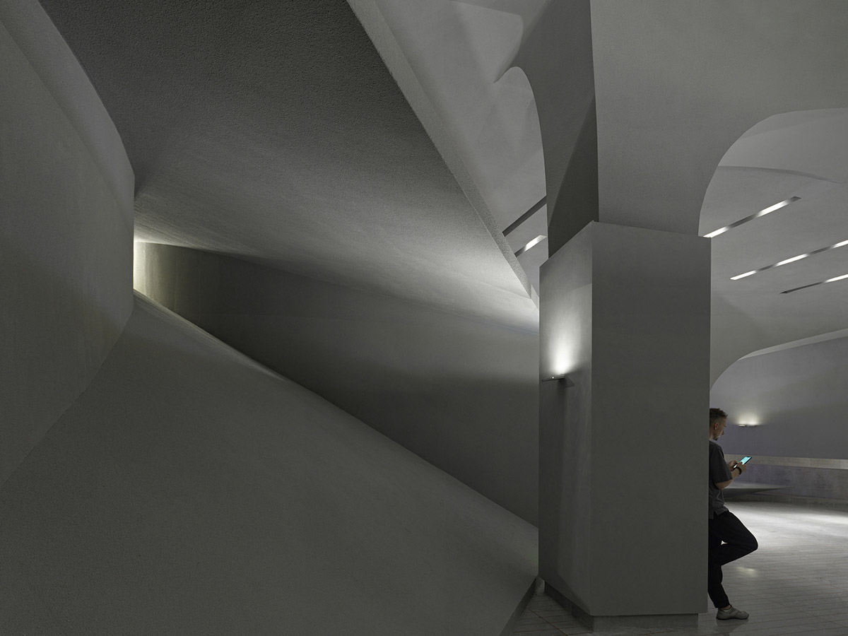 Greyscale interior provides acoustically comfortable space for a cinema by One Plus Partnership