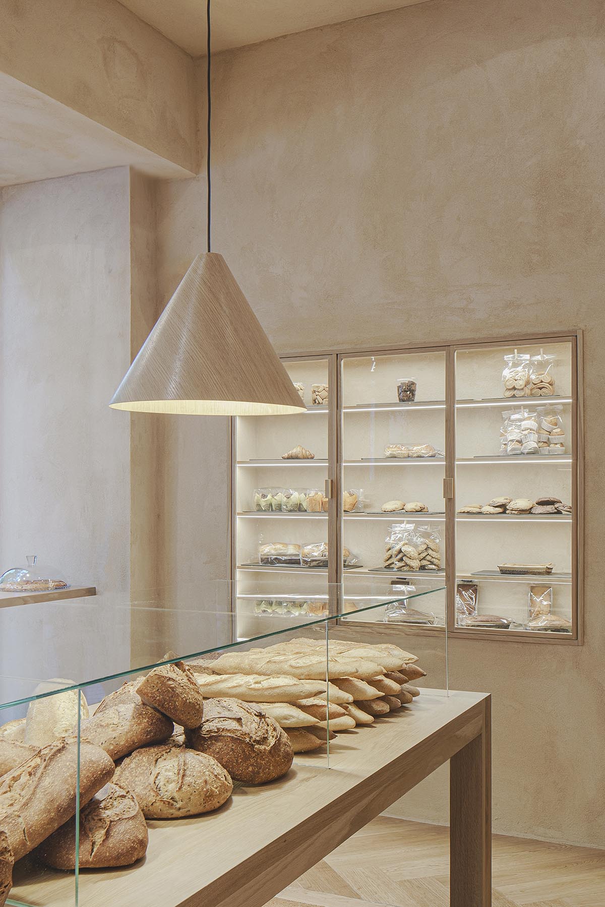 Bakery features central oak tables that revive the traditional dining room experience 