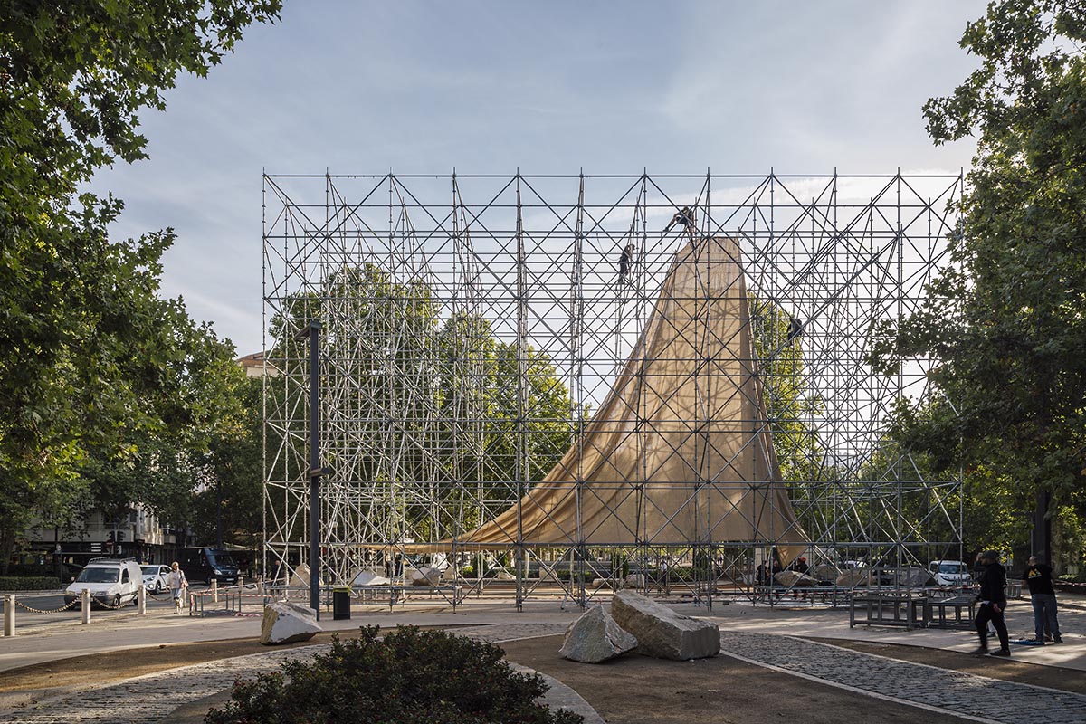 Aire Pavilion wrapped by giant scaffolding represents 