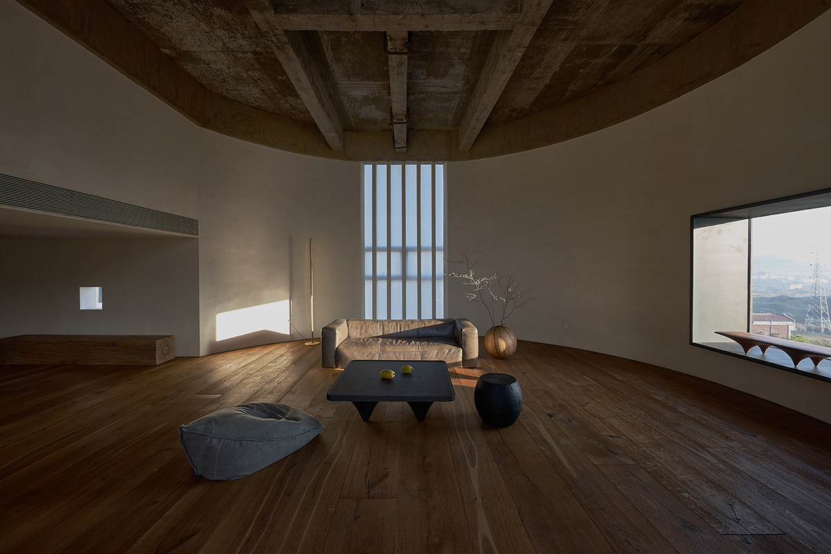 ZMY Design creates earth-toned interiors for a woodwork enthusiast’s house in Fujian, China