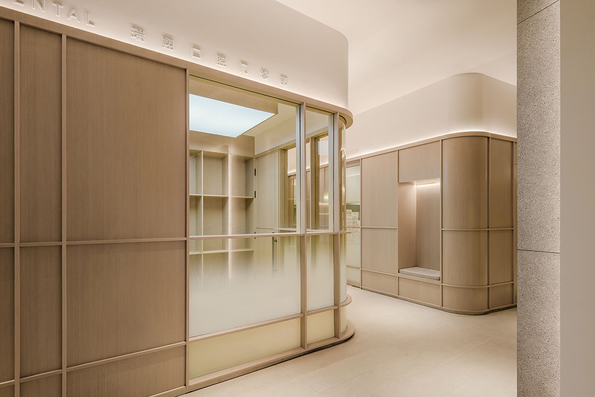 JACKY.W DESIGN completes dental clinic with rounded wooden walls and natural tones in China 
