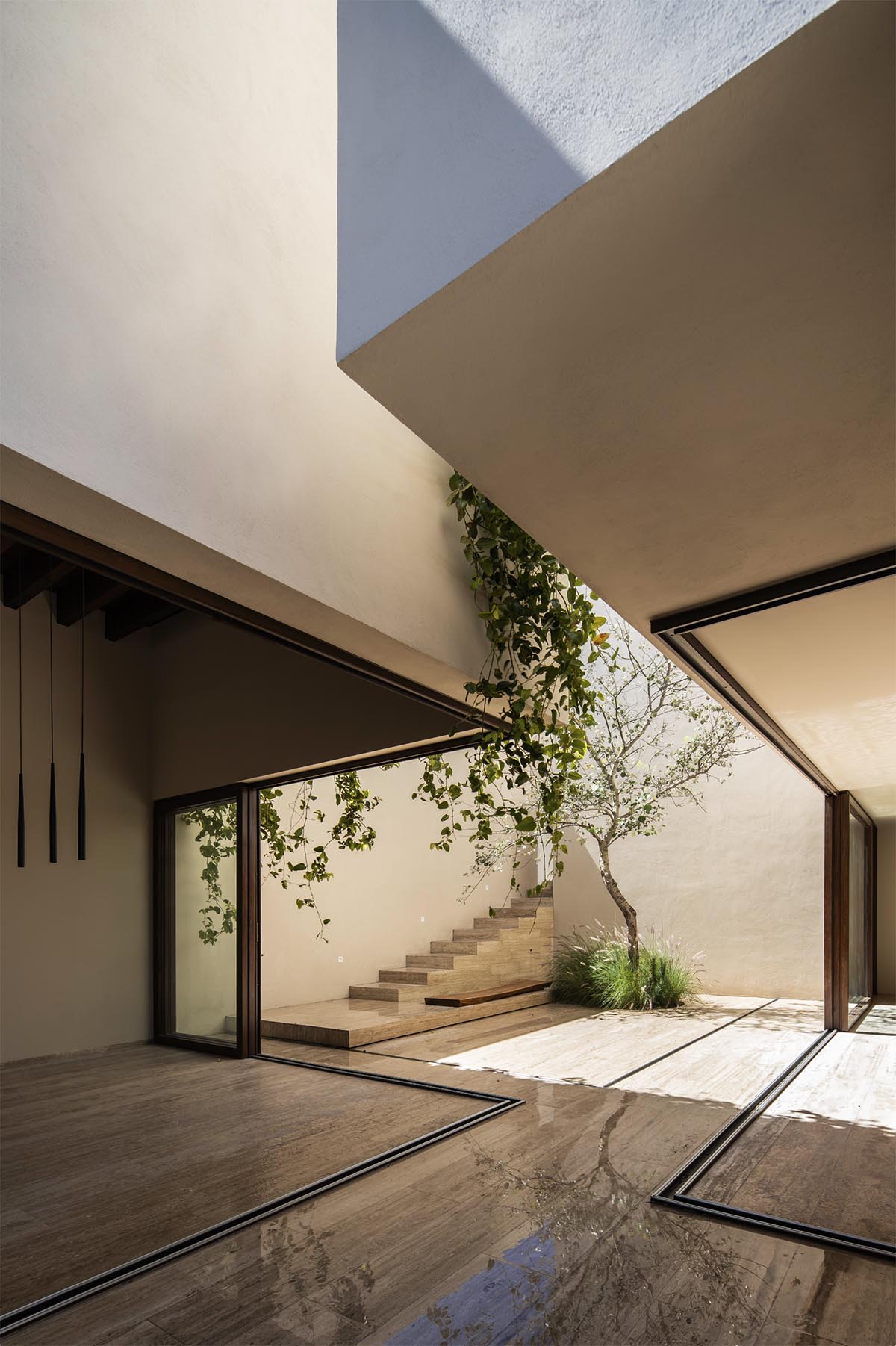 Sabino 10 residence by Editorial features a solid façade with hermetic volumes in Mexico