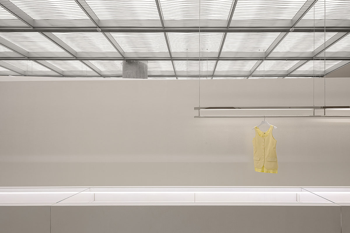 Various Associates creates show-like and pink-hued fashion store under a viaduct in Chongqing