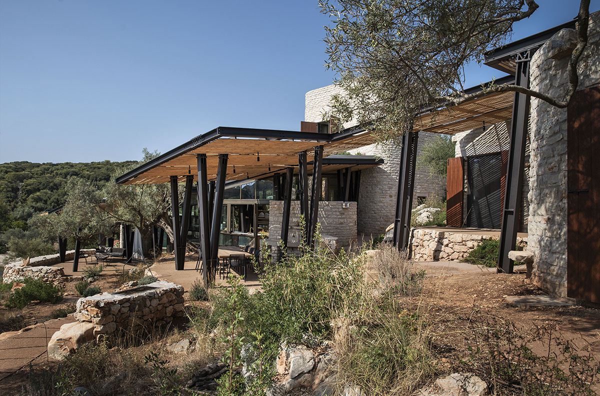 Pastoral round stone dwellings inform Meganisi House by Hiboux Architecture on Meganisi island