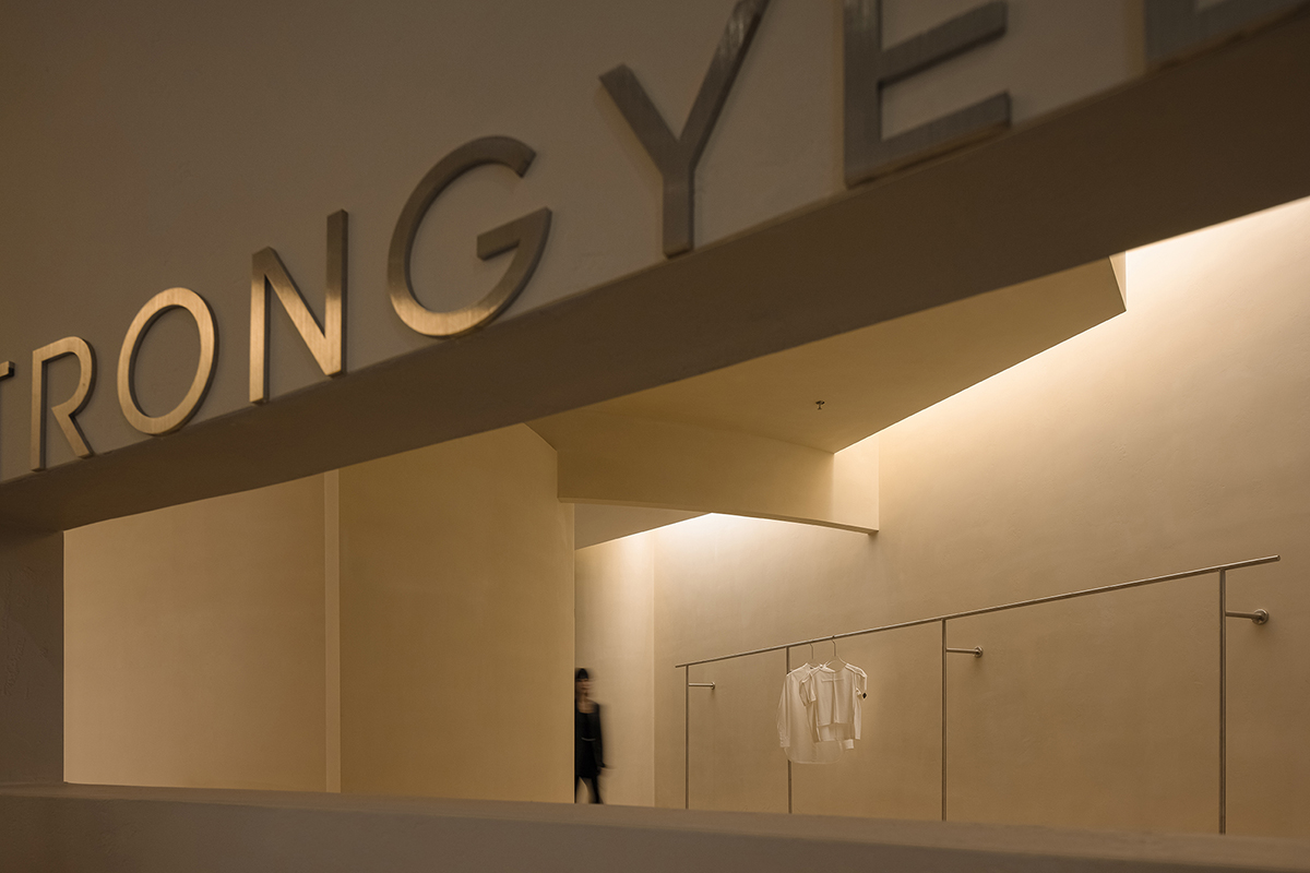 AD ARCHITECTURE designs store with light yellow curved walls that create comfort and softness 