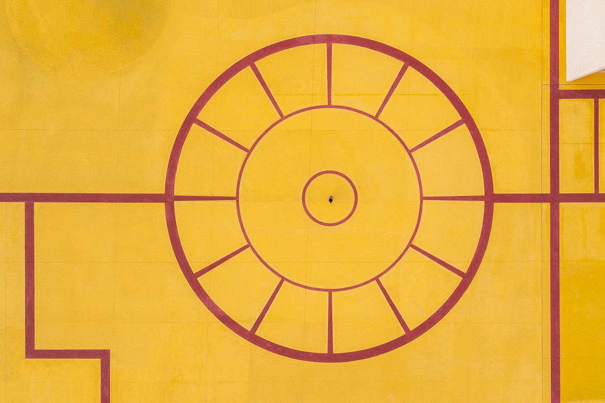 Wutopia Lab converts abandoned barnyard into a golden yellow field resembling a frozen harvest time