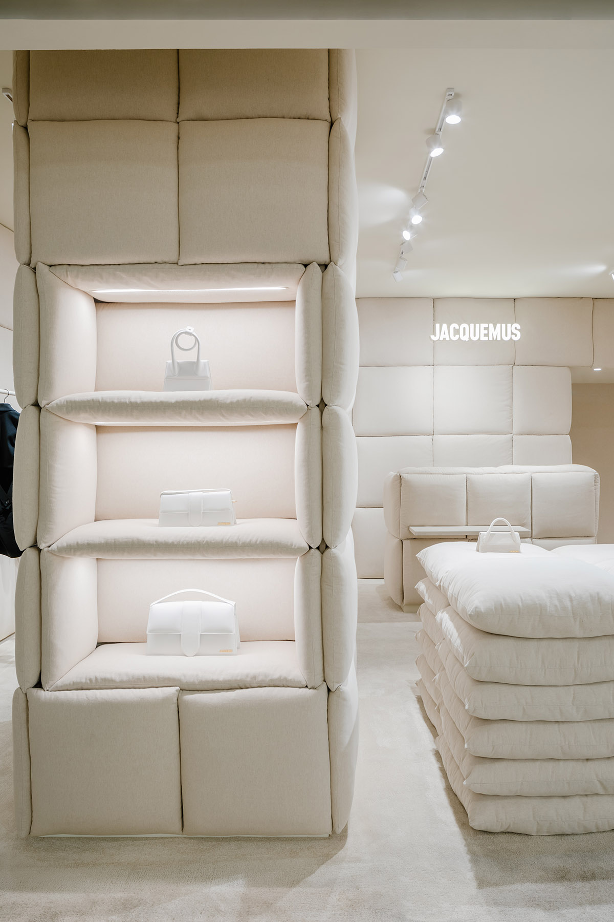 AMO clads Jacquemus' shop-in-shop boutique with white pillows that guide the space