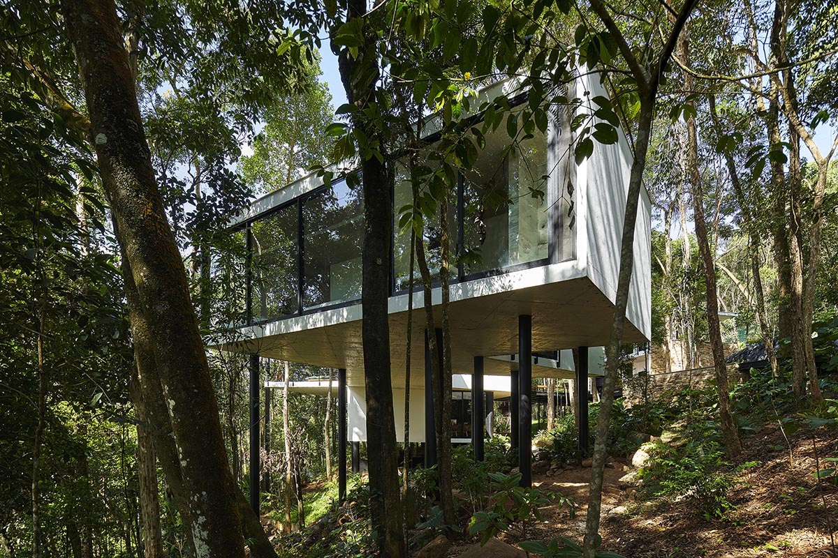 TETRO Arquitetura built zig-zag floating house raised on steel pillars in a lush Brazilian forest