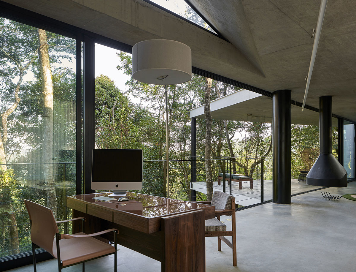 TETRO Arquitetura built zig-zag floating house raised on steel pillars in a lush Brazilian forest