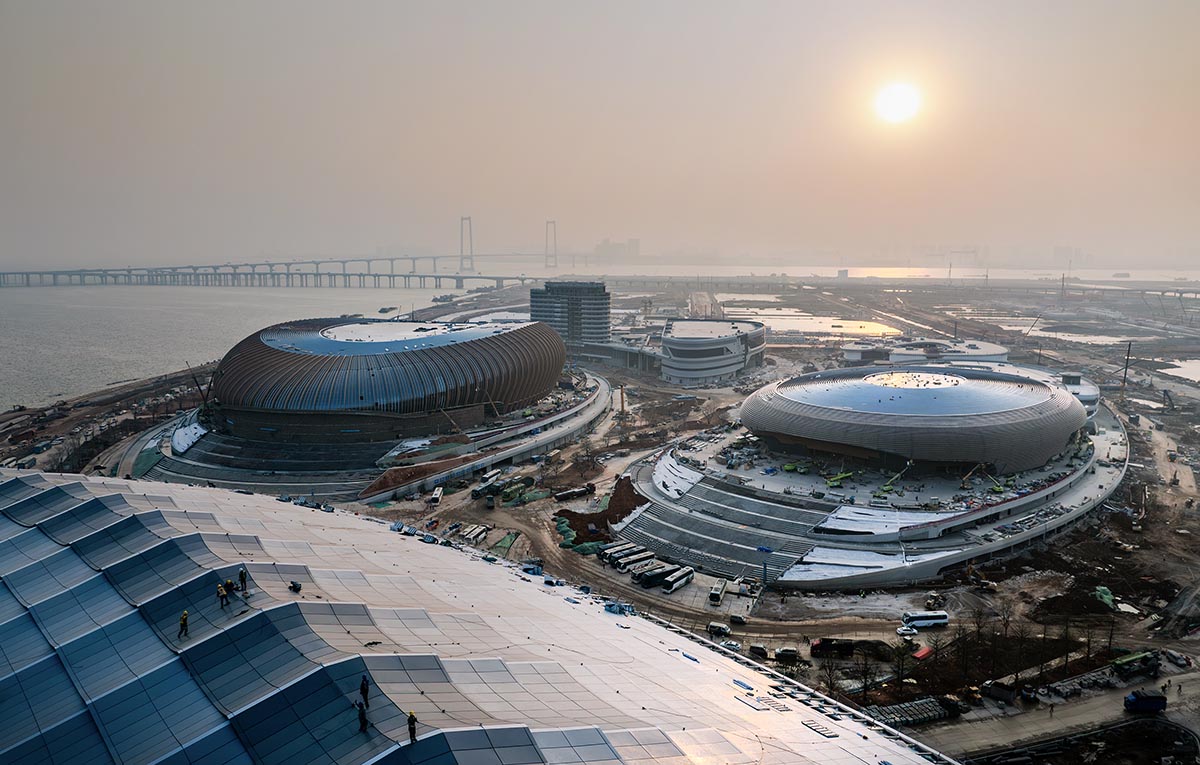 ZHA's Greater Bay Area Sports Centre, featuring distinctive layered roof, nears completion in China