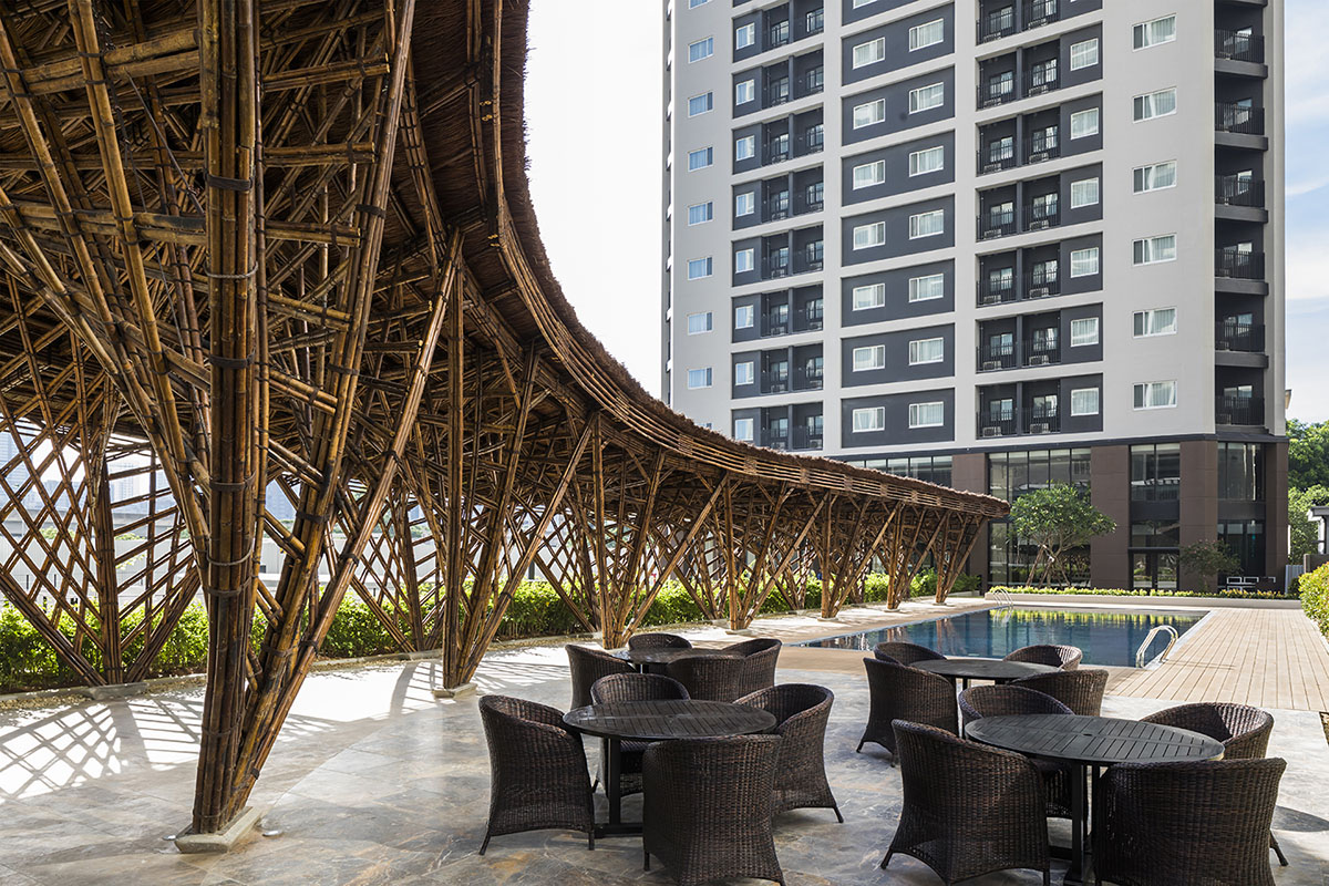 VTN Architects' Vinata Bamboo Pavilion creates a natural pathway in a garden of high-rise buildings