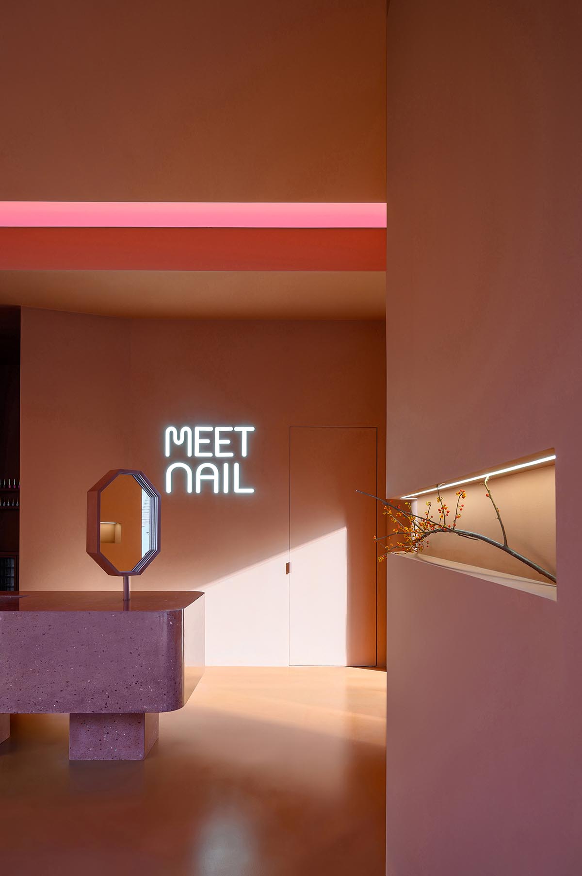 Bold peachy colors define interiors of nail flag store designed by 8877 Interiors in Shanghai 