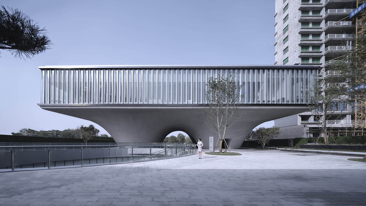 Community Center in Xi’an is raised on sculptural base that features a rippling effect
