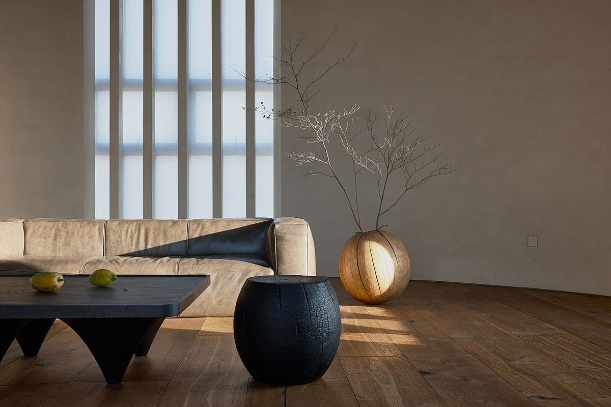 ZMY Design creates earth-toned interiors for a woodwork enthusiast’s house in Fujian, China