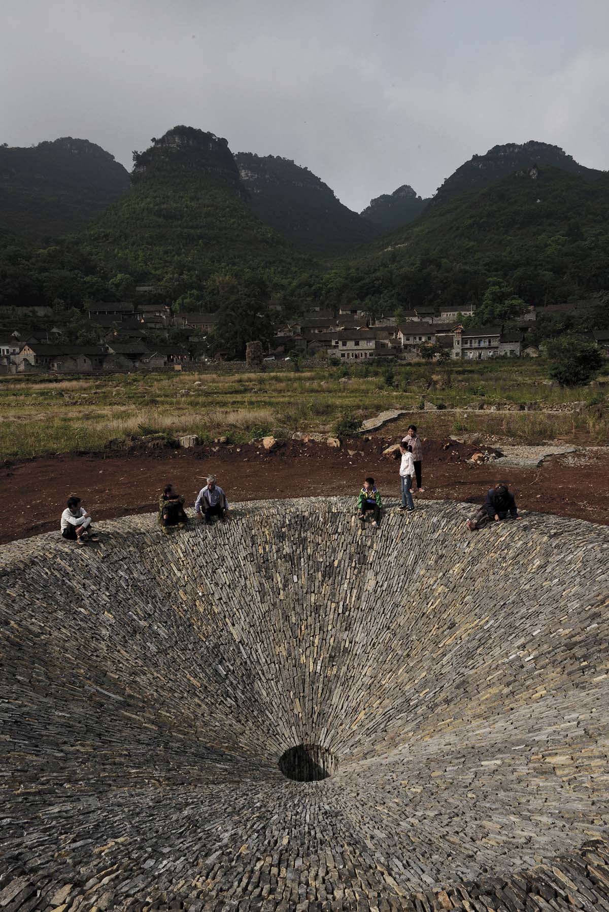 This 2,4-metre trumpet-flower-shaped sinkhole sustains rain