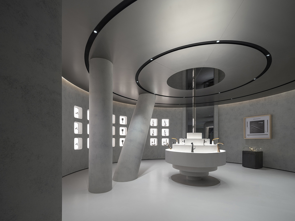 E Studio takes visitors into space travel with a flow of sculpted stainless steel for a showroom