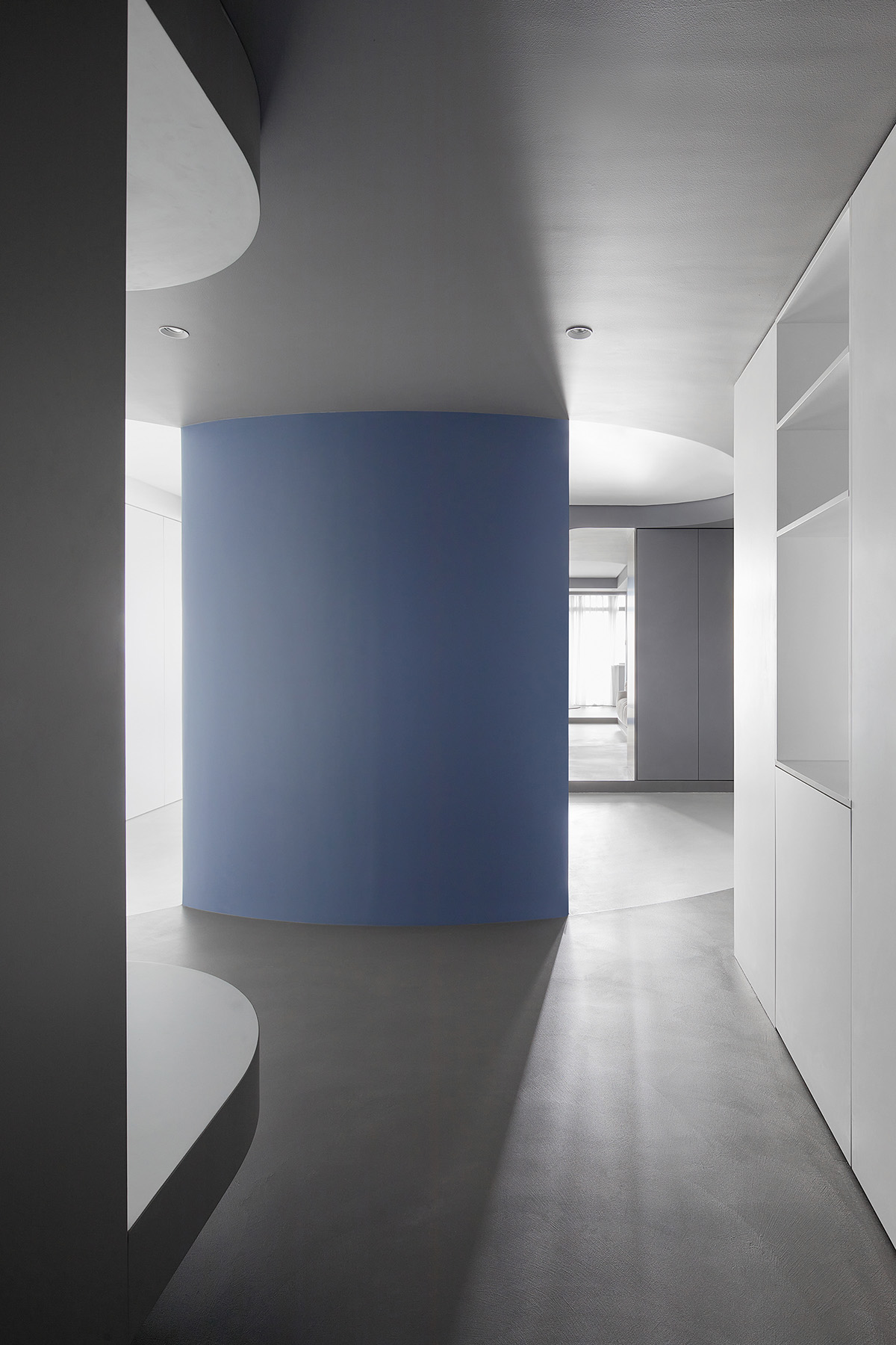 XIGO STUDIO creates gray and blue-colored interiors for apartment in Beijing 