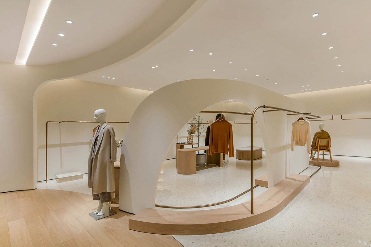 JYDP designs retail space with warm tones and curved walls in Shanghai