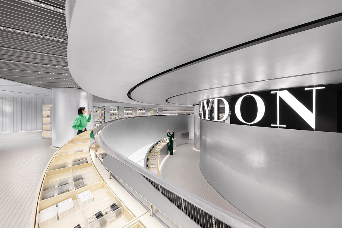 Various Associates designs beauty store with winding staircase and silver-toned interiors in Hangzhou