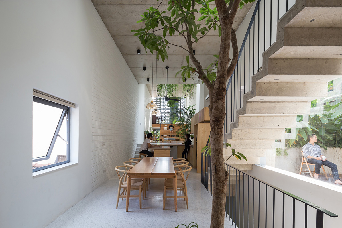 ODDO architects built this narrow house with rich interior spaces and perforated skin in Hanoi