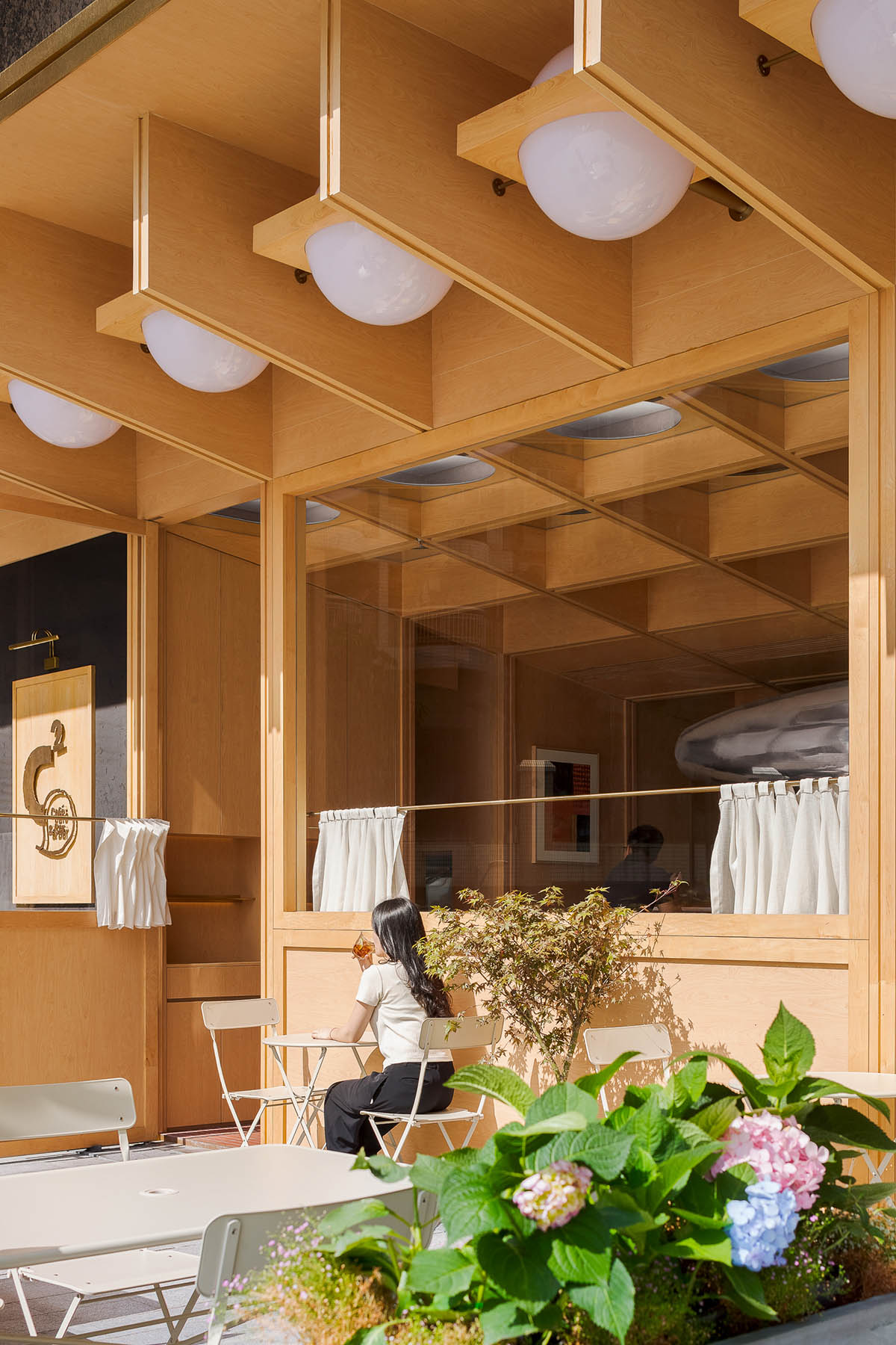 Various Associates completes C² Cafe & Bar in Shenzhen with wooden ceiling details