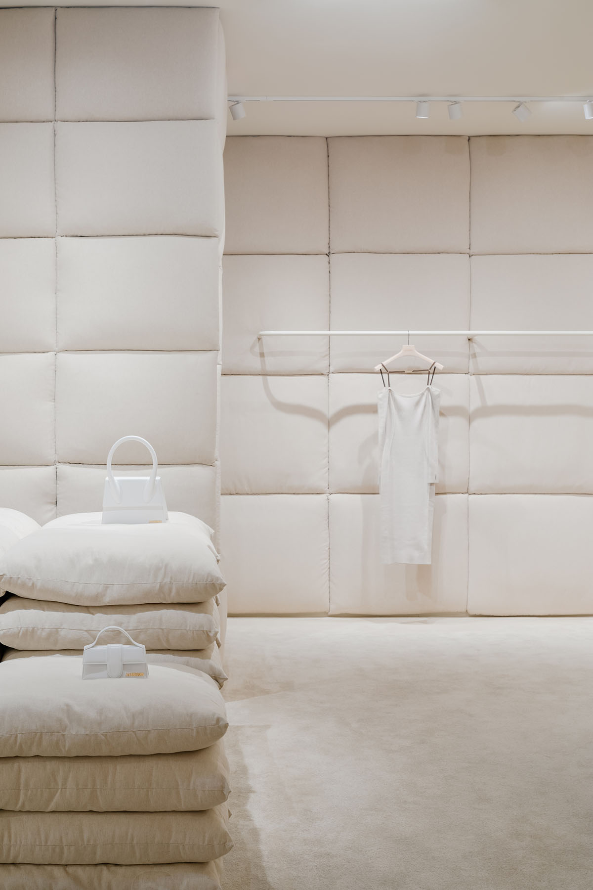 AMO clads Jacquemus' shop-in-shop boutique with white pillows that guide the space