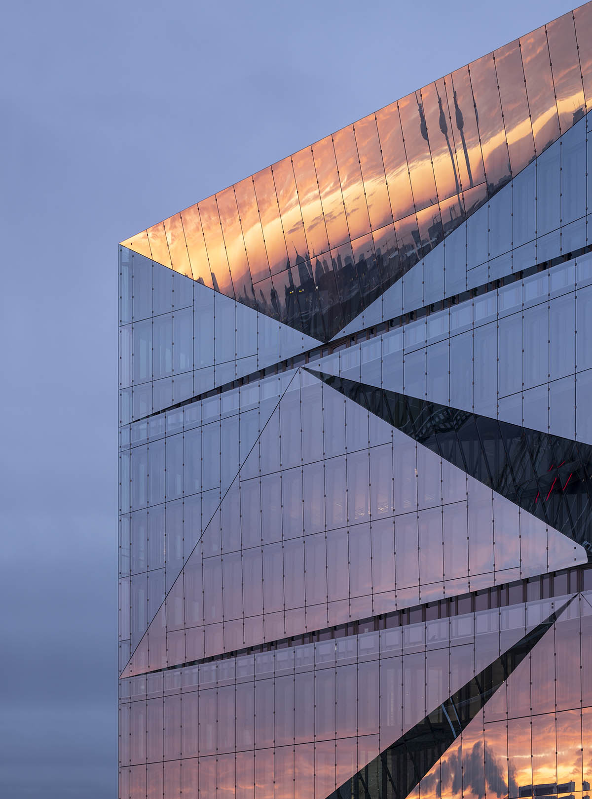 3XN's sculptural and fully glazed smart office building opens in Berlin