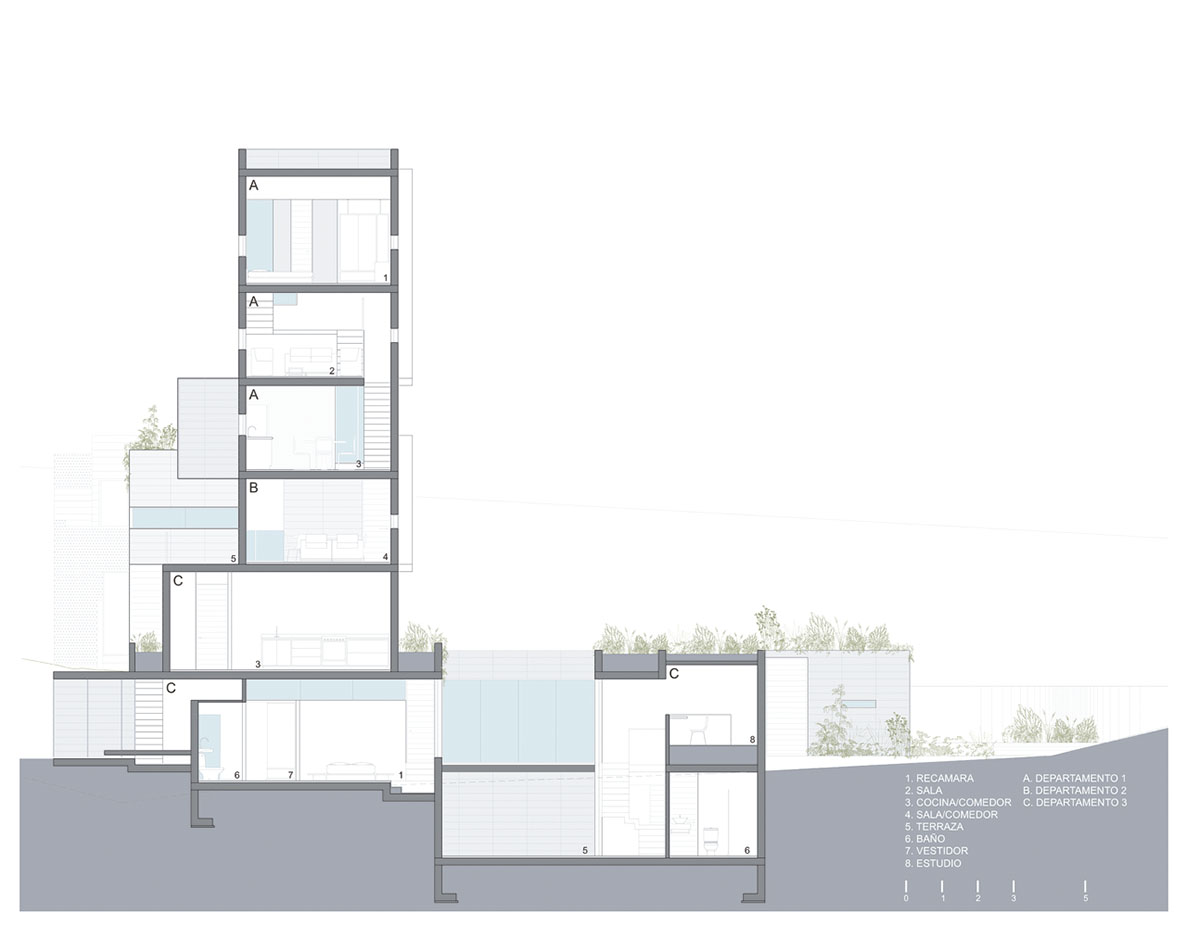 Earth-toned apartment building prioritizes views towards a forest in Coatepec, Mexico
