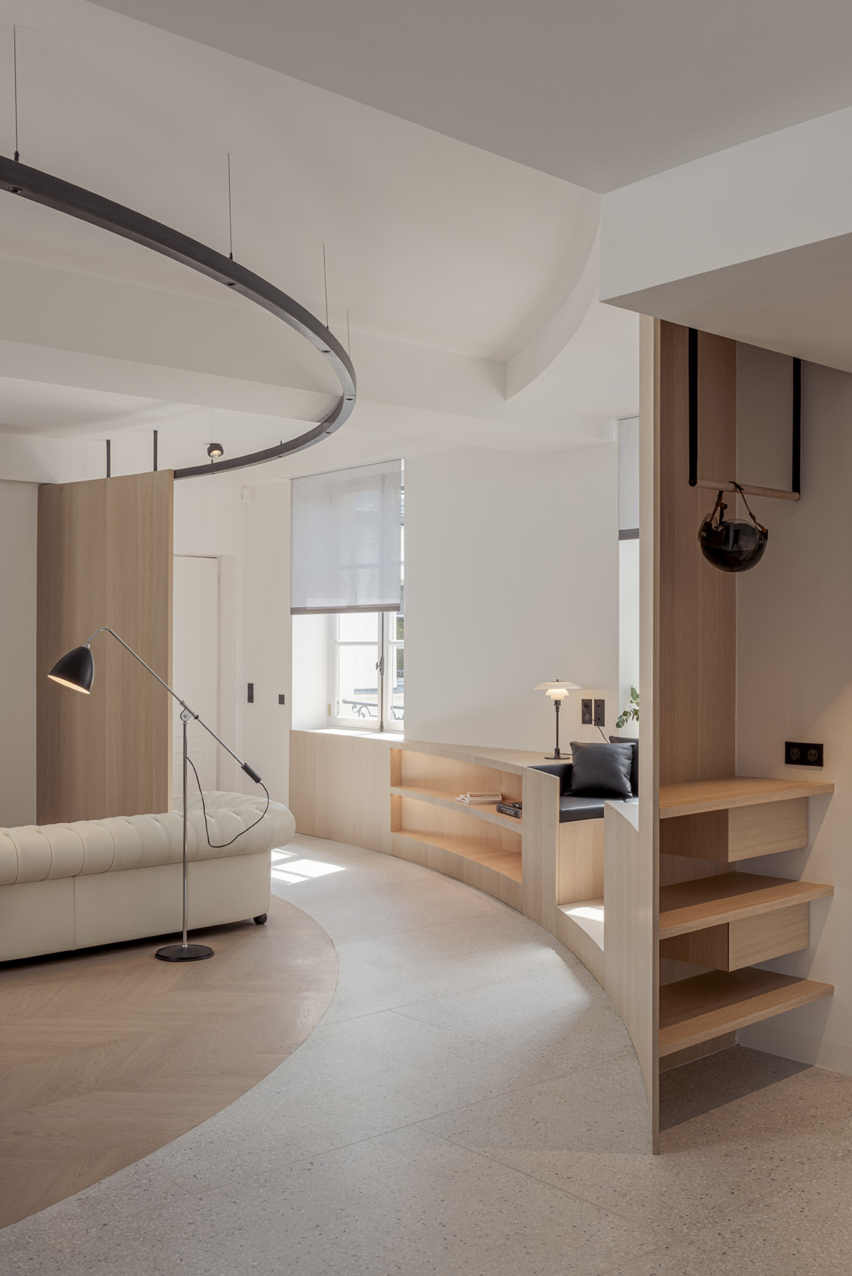 noa* converts 18th century hotel in Paris into an apartment with curved lines and scent of wood