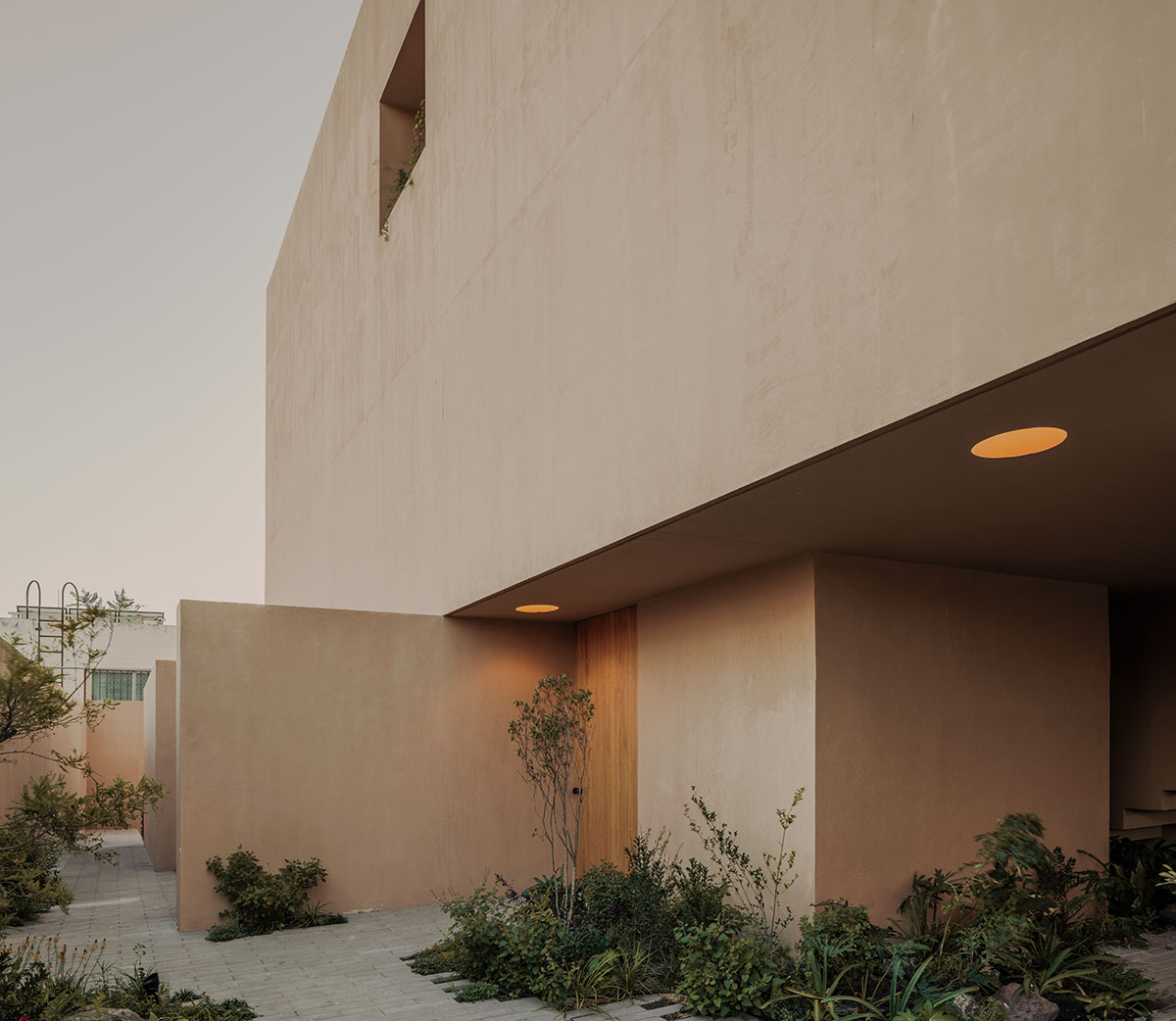 Taller Segovia Molina enriches beige Casa Aguilar with interior patios and an abundance of light