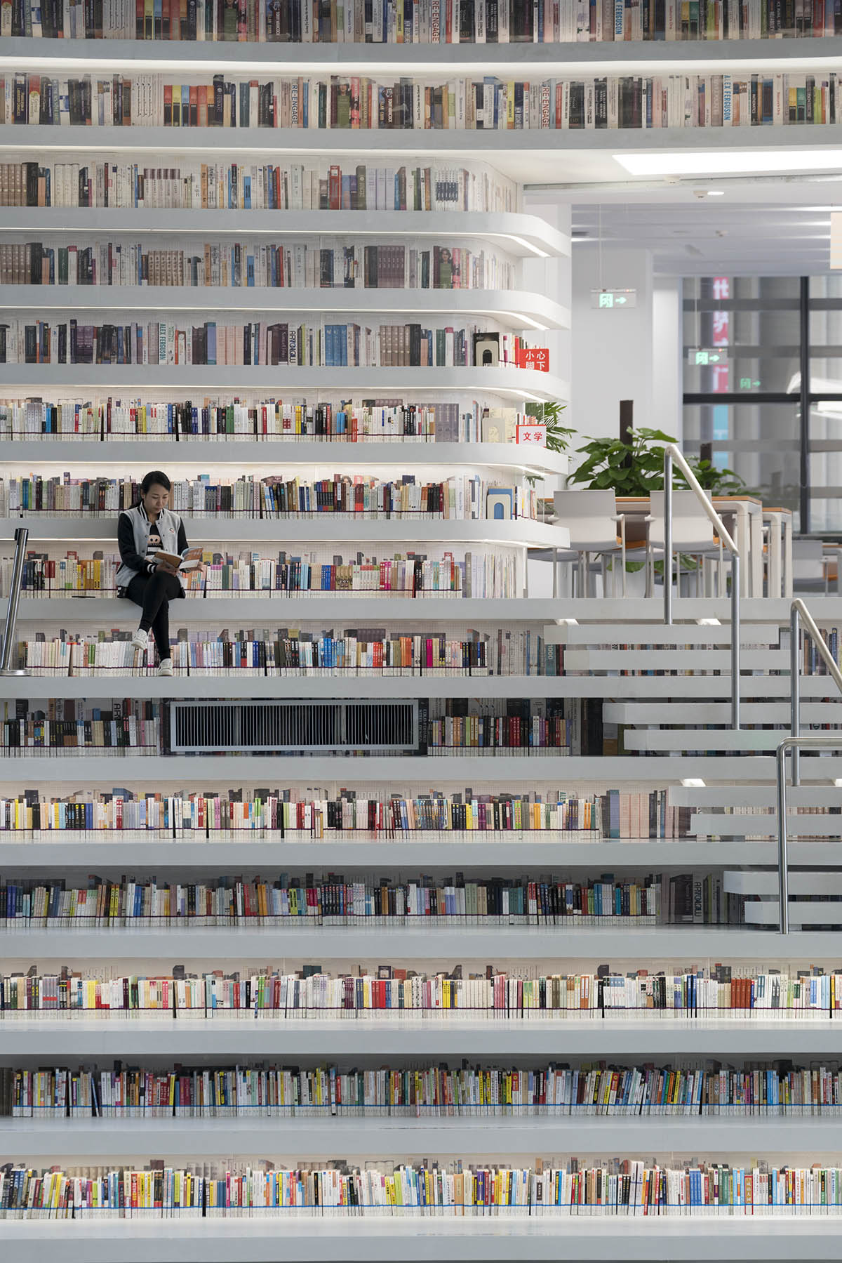 MVRDV’s topographical Tianjin Binhai Public Library featuring millions of books opens in China