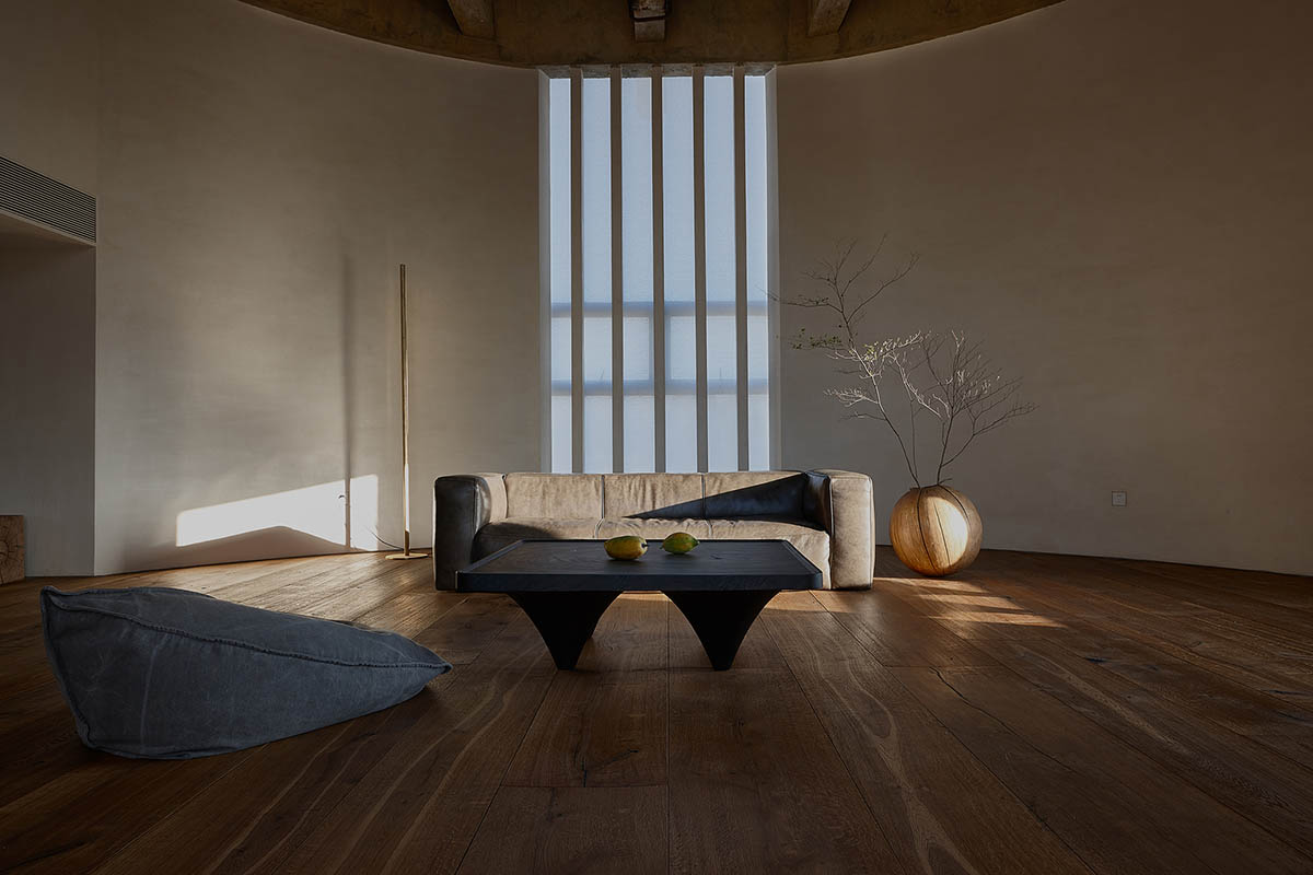 ZMY Design creates earth-toned interiors for a woodwork enthusiast’s house in Fujian, China