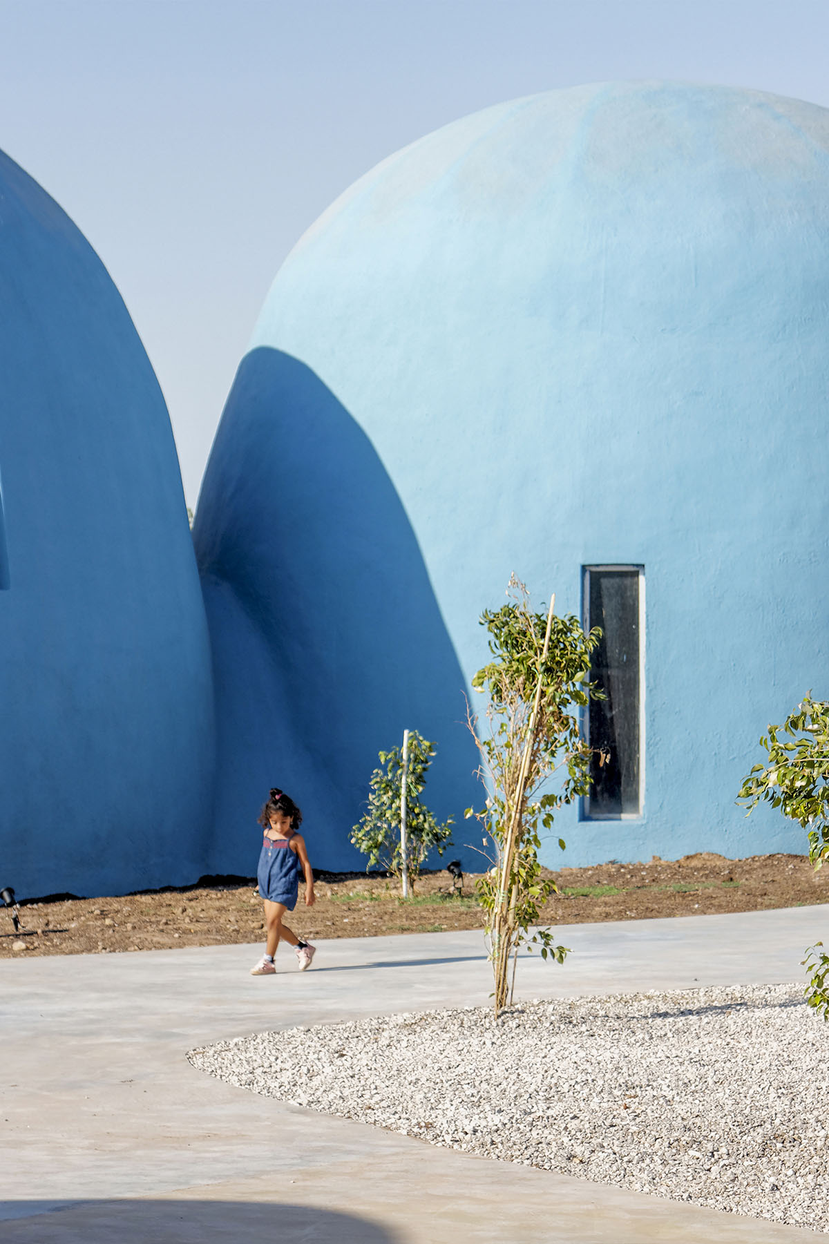 ZAV Architects built colorful-domed housing made of rammed earth and sand on Hormuz island, Iran