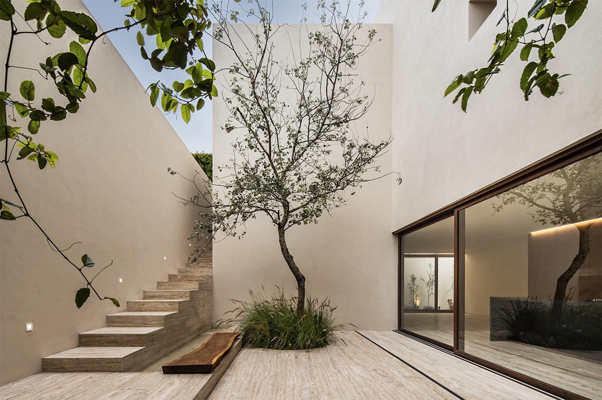 Sabino 10 residence by Editorial features a solid façade with hermetic volumes in Mexico