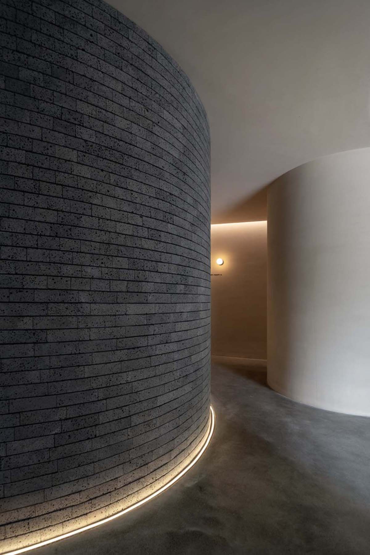 Smooth corners and rounded walls form cave-like wellness center designed by E Studio in China