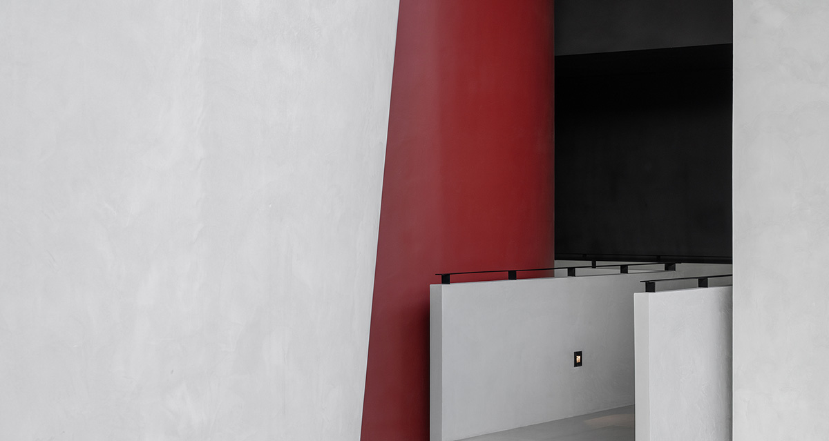 Masanori Designs' interiors include red cylinder bringing rainwater into the space