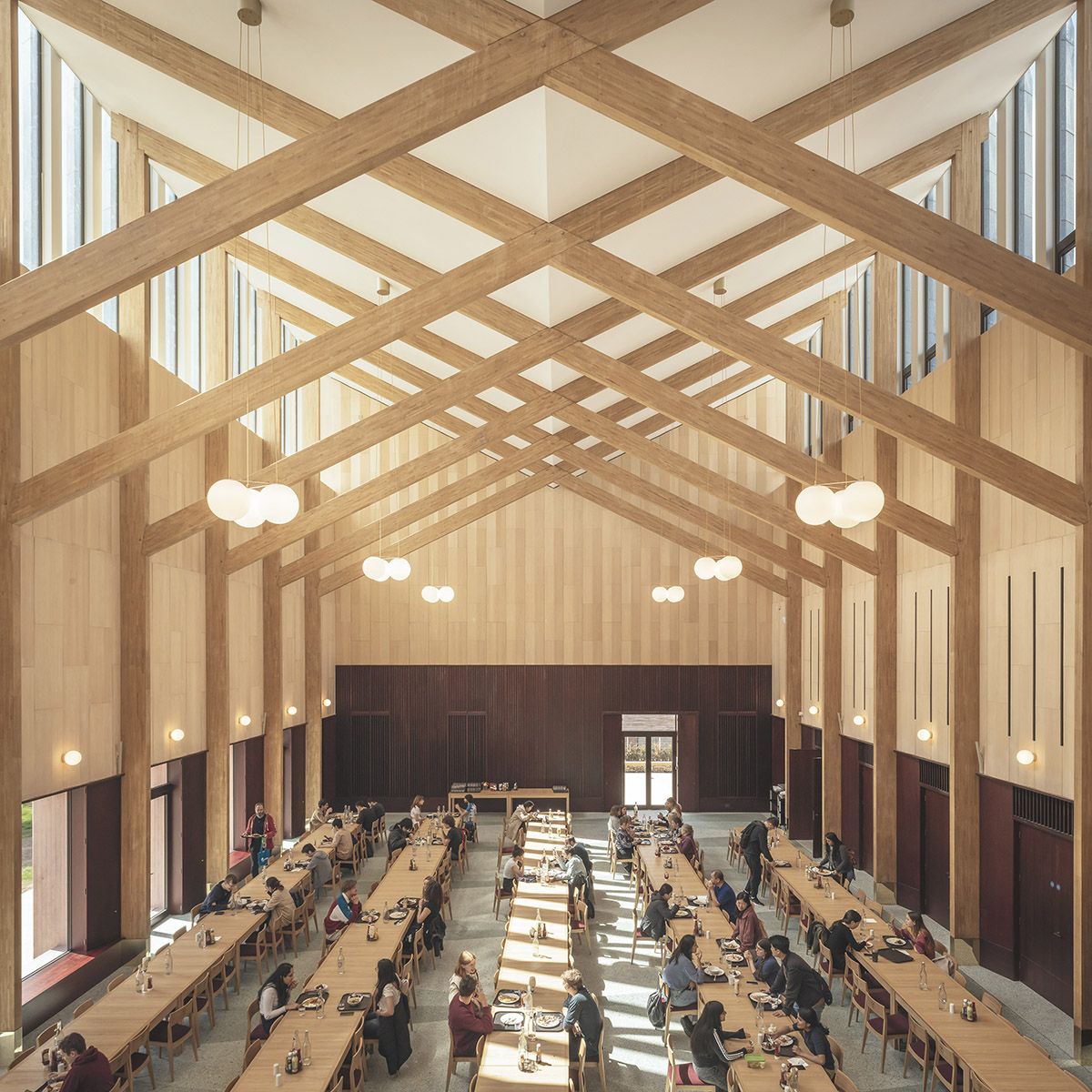 Feilden Fowles completes dining hall wrapped in green faience tiles at University of Cambridge
